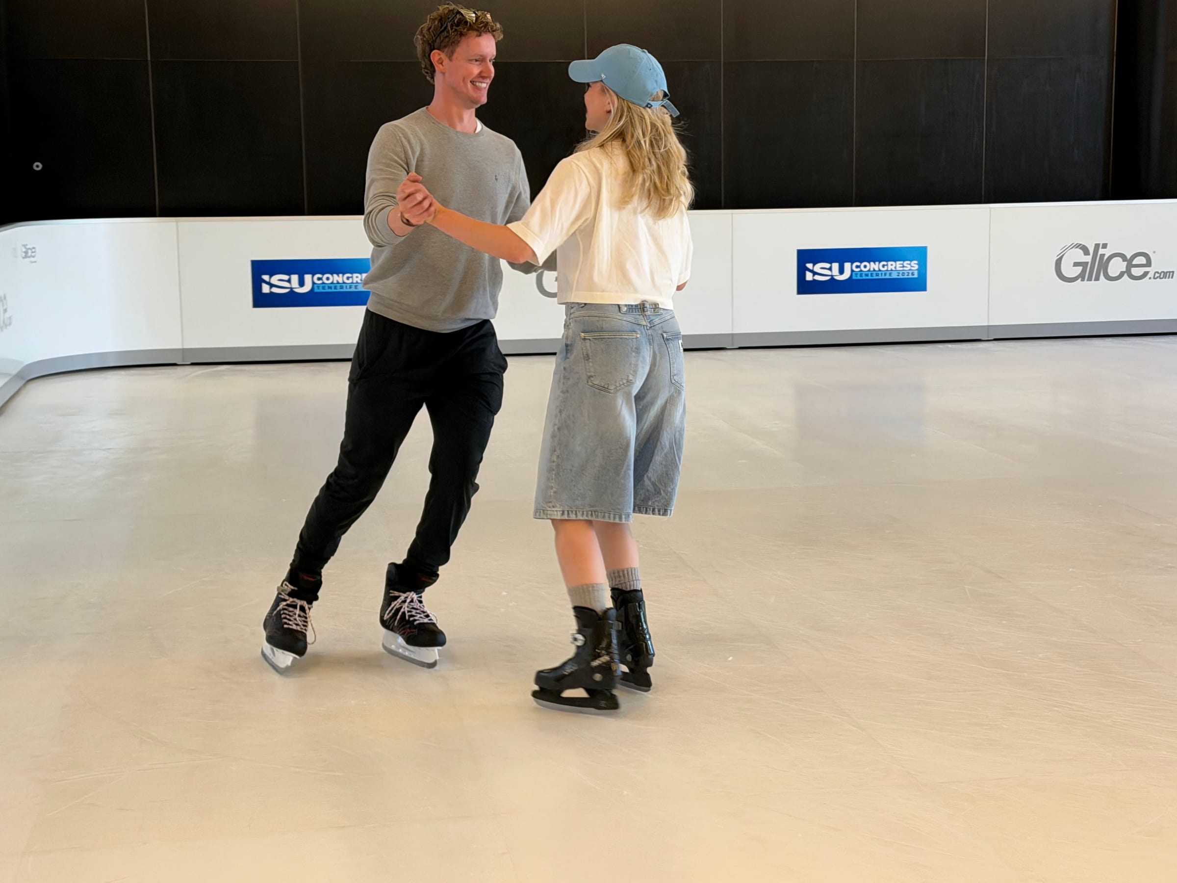 Evan Bates and Kaitlyn Weaver testing Glice synthetic ice at the 2026 ISU World Congress