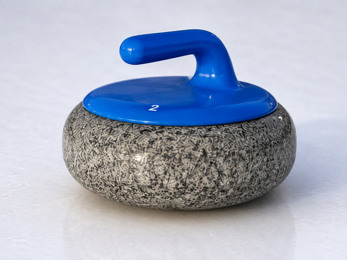 Blue-handled curling stone designed for use on a Glice curling surface