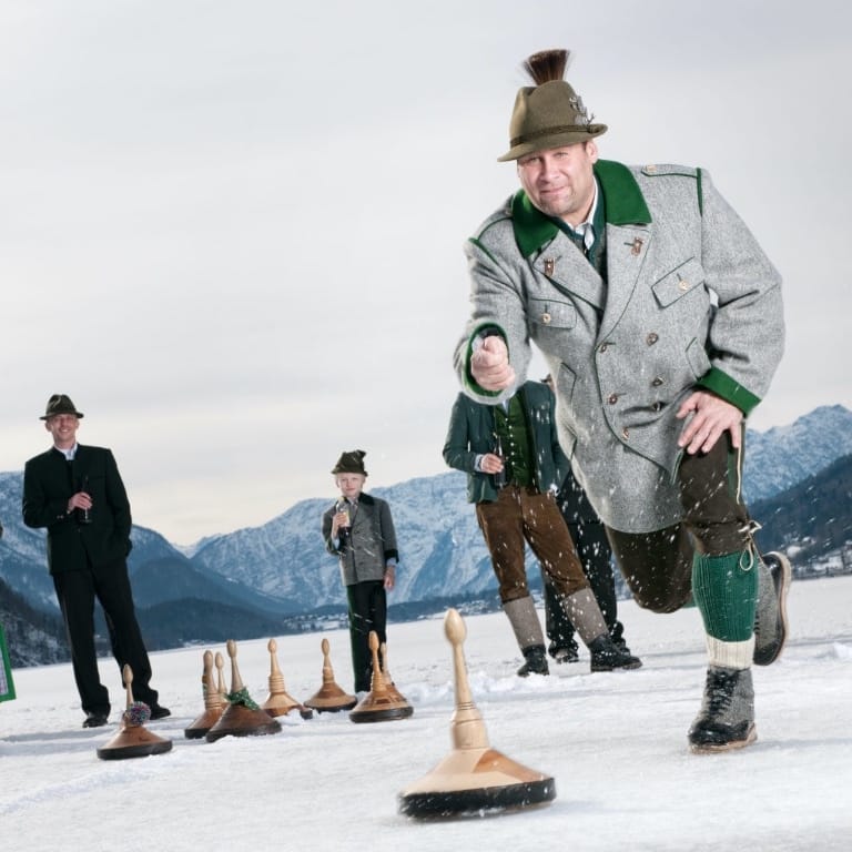 Historic Eisstock - traditional Bavarian Curling on a frozen Alpine lake