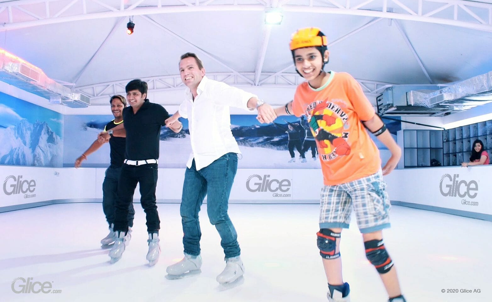Skaters sharing a Glice synthetic ice rink