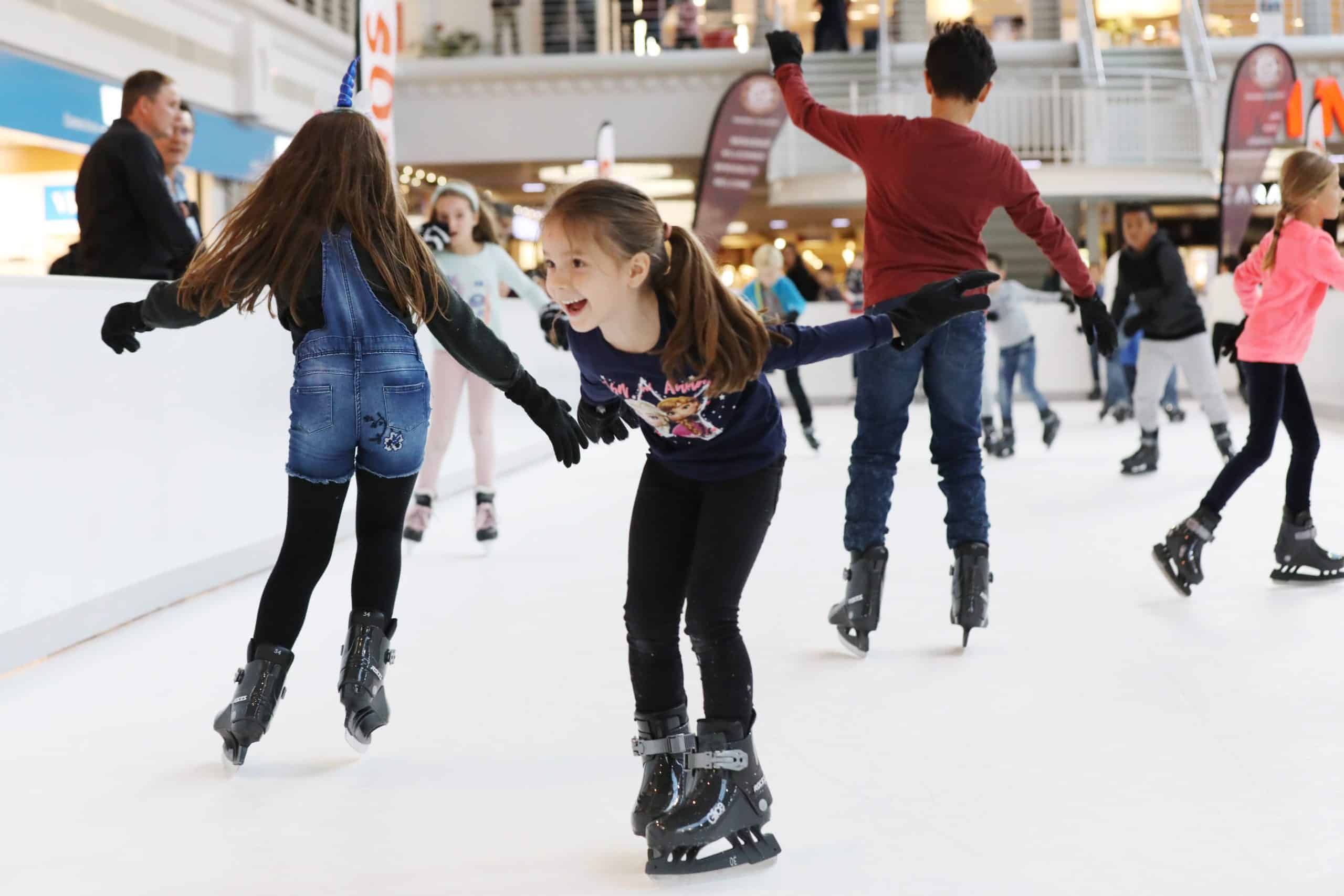 Young skaters enjoying a community skating rink