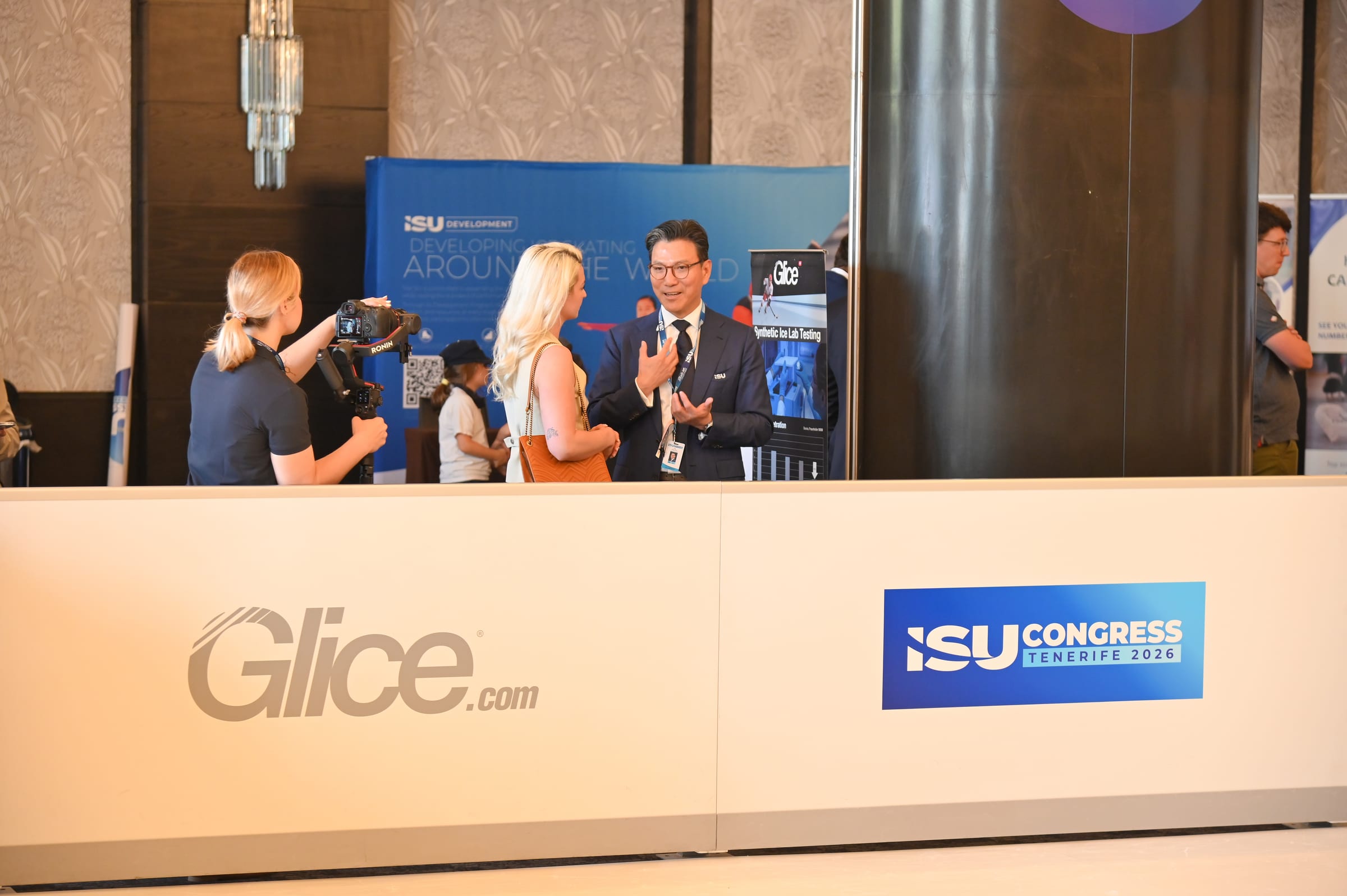 ISU President Kim visiting the Glice synthetic ice demonstration at the 2026 ISU World Congress