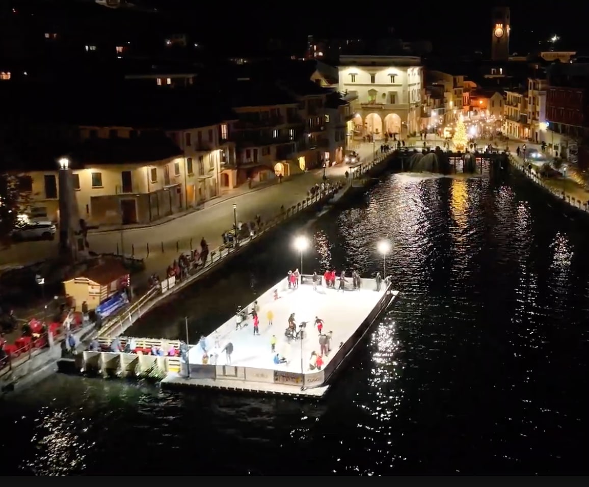 Floating skating rink on Lago Maggiore illuminated at night