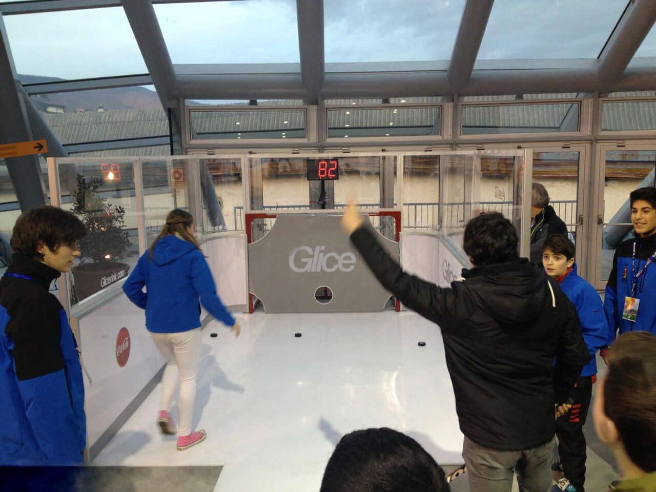 Having fun at plastic ice slapshot station