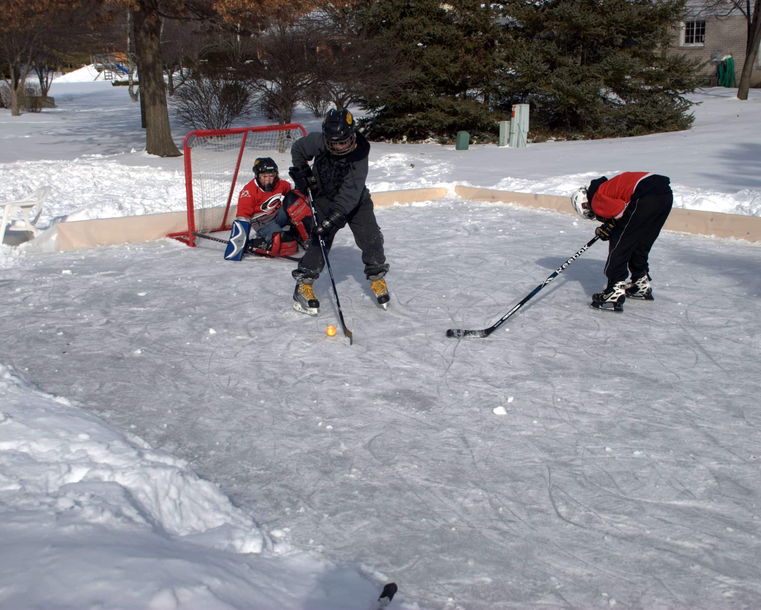 Hockey match on a DIY backyard ice rink