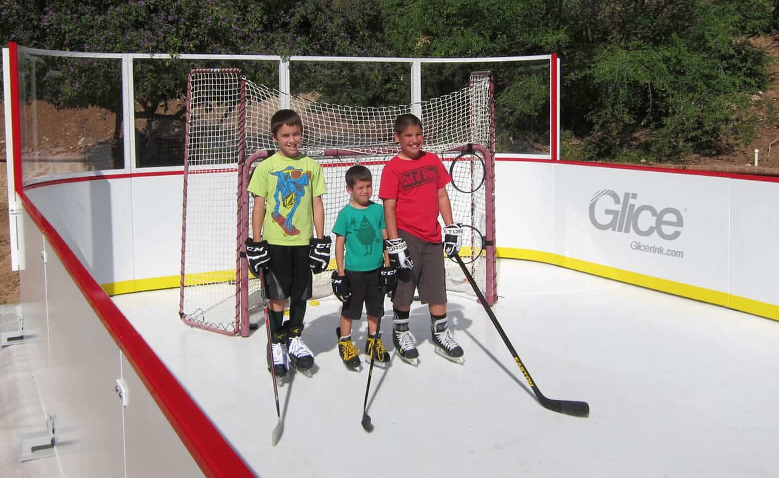 Kids on synthetic ice rink mini arena