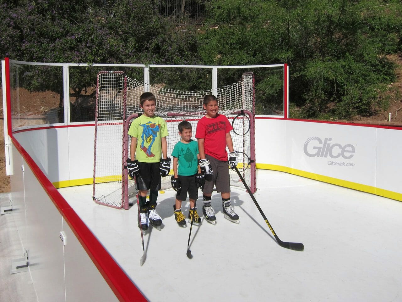 Kids on synthetic ice rink mini arena