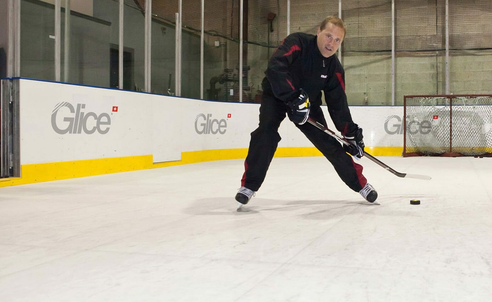 NHL veteran Cliff Ronning practicing on artificial ice rink