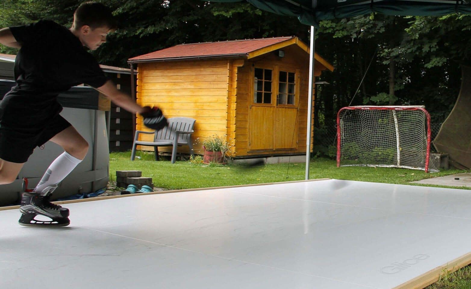 Swiss kid practicing on synthetic ice pad