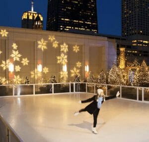 Woman figure skating on synthetic ice