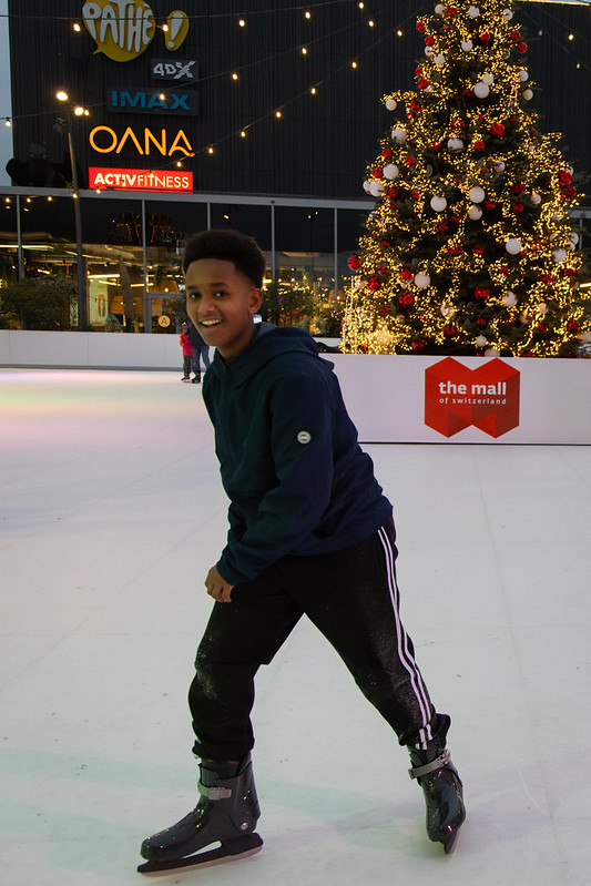 Boy skating on synthetic ice