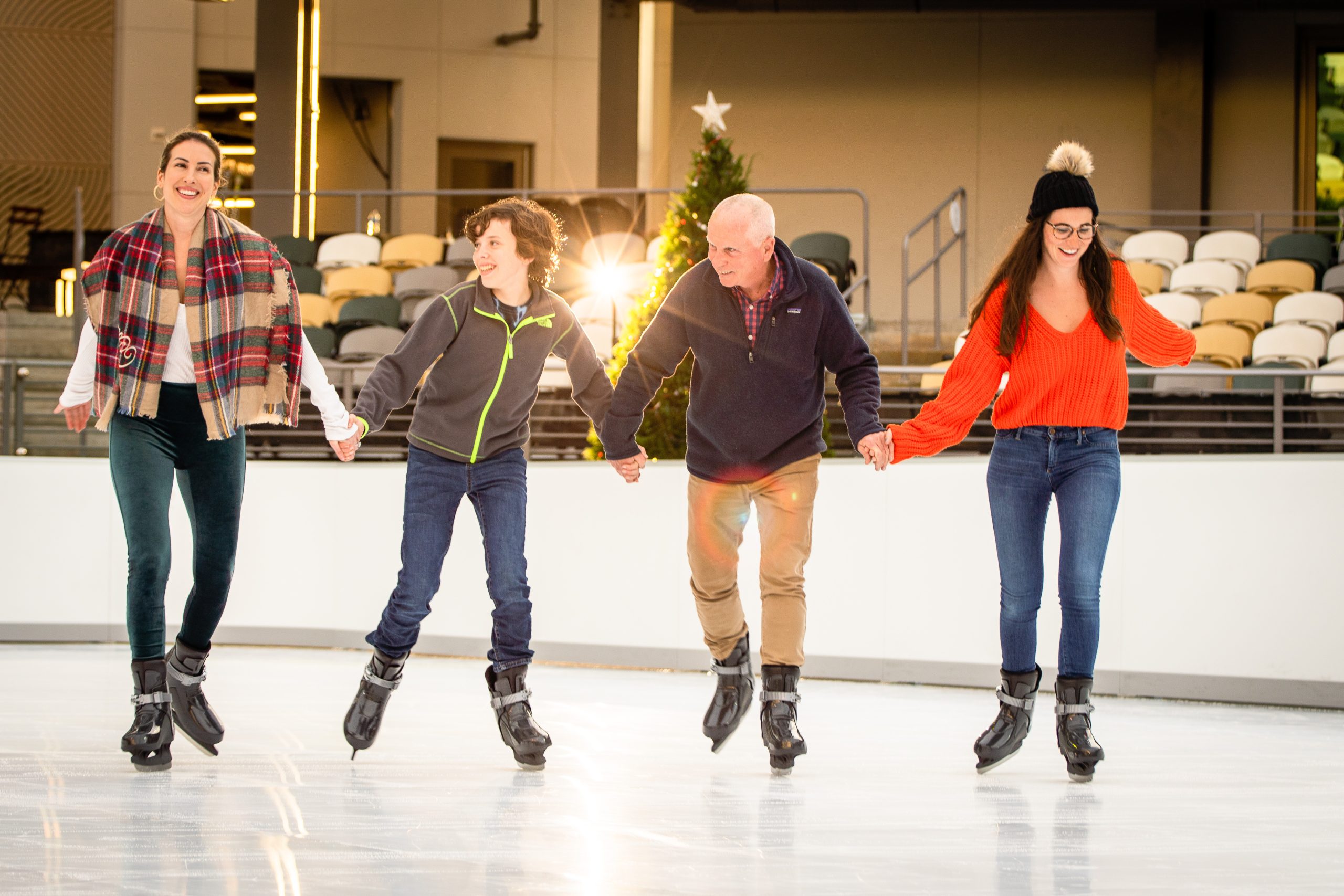 family ice skating together