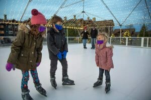 Kids ice skating together