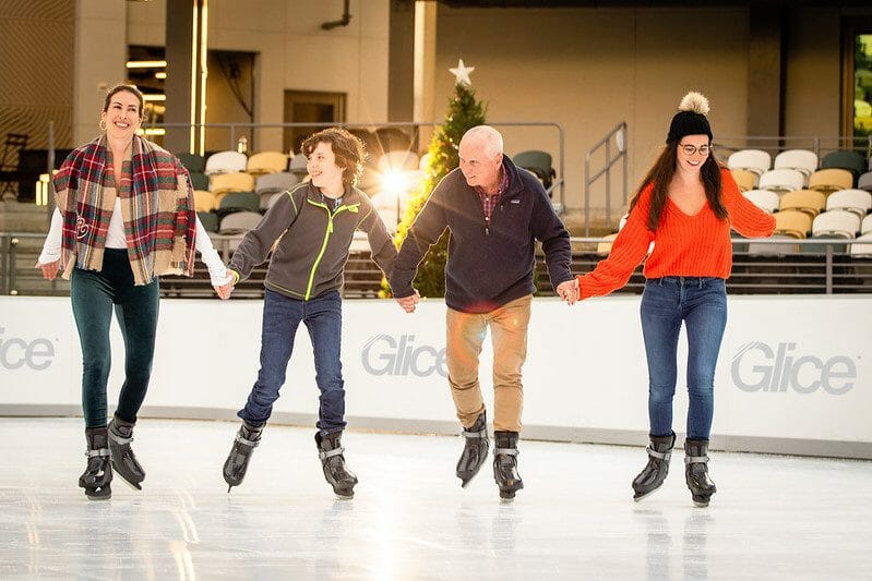 Family skating hand in hand