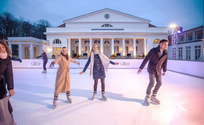 Friends ice skating together