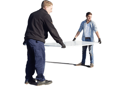 Two men carrying a large synthetic ice tile