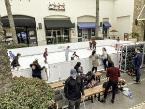 Outdoor Glice rink outside a mall in California - location is a key component of a synthetic ice rink business plan