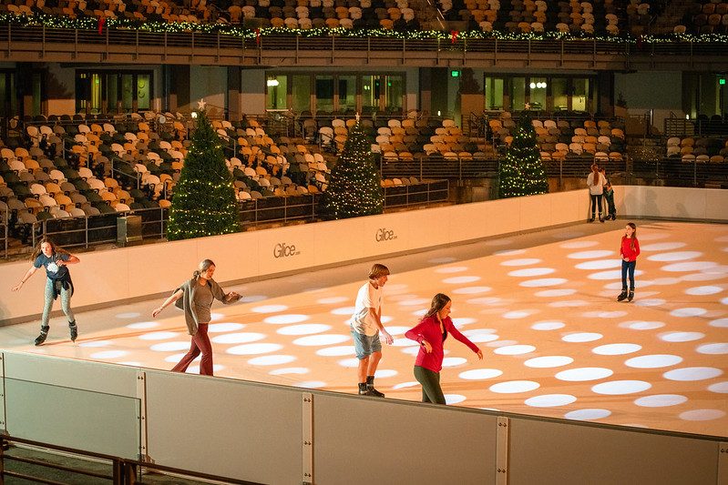 people ice skating on synthetic ice
