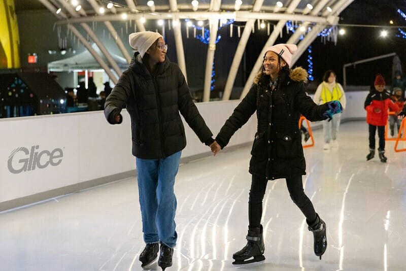 Two girls ice skating