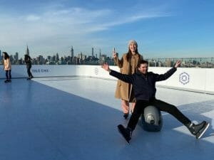 A couple ice skating in New York