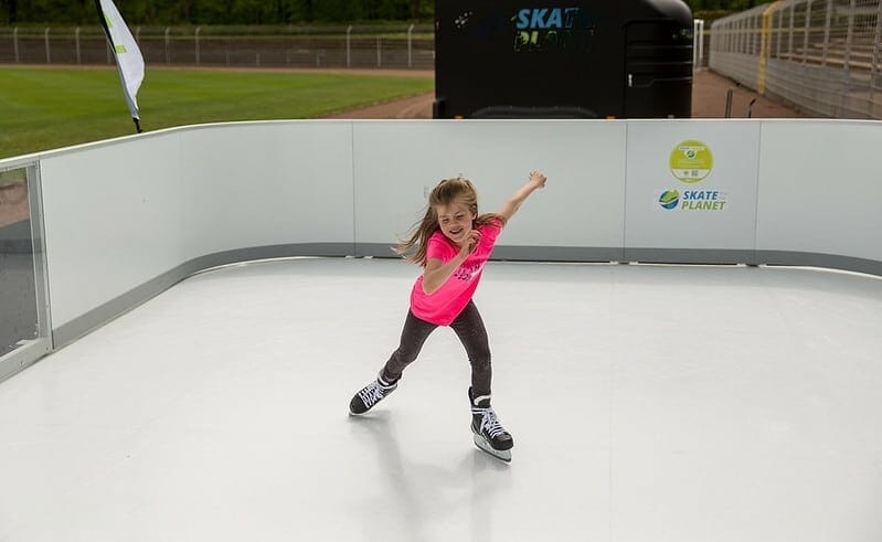 Girl skating on ice rink